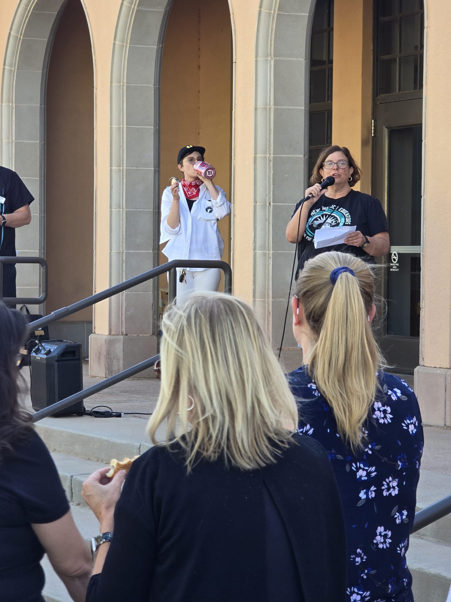 Jamie Bronstein speaking at a May Day Rally in 2025